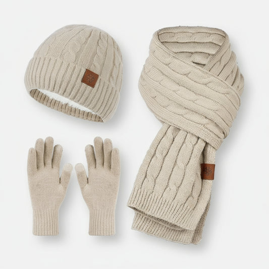 A set of women's knitted hat, scarf, and gloves in beige color, displayed on a white background.