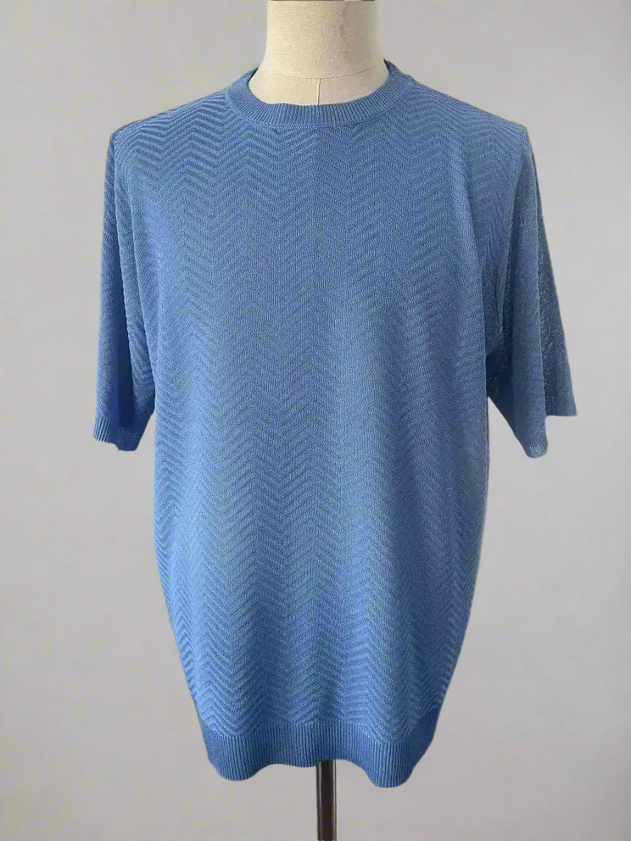 Blue short-sleeve sweater on a mannequin against a plain background