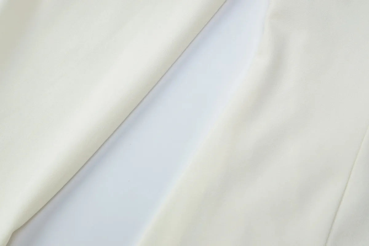 Close-up of light gray fabric with a subtle texture on a white background