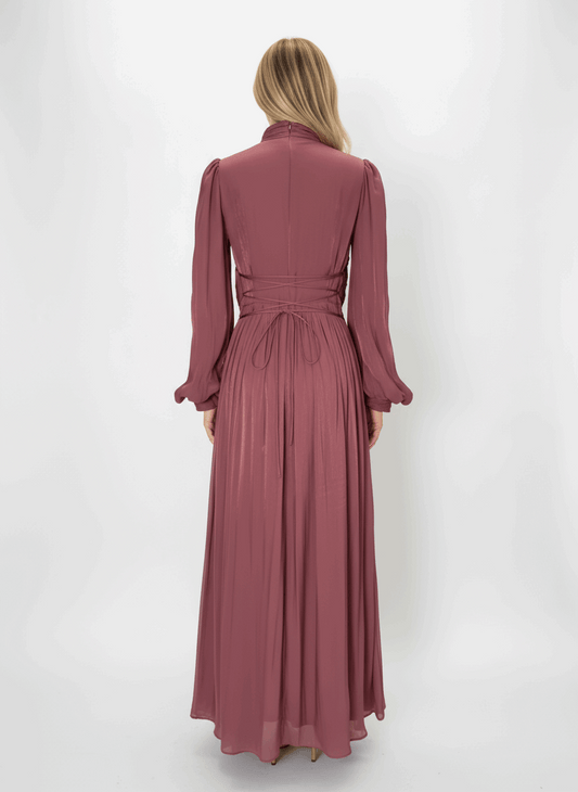 Full-length view of modest maxi dress with ruched bodice and flowing pleated skirt