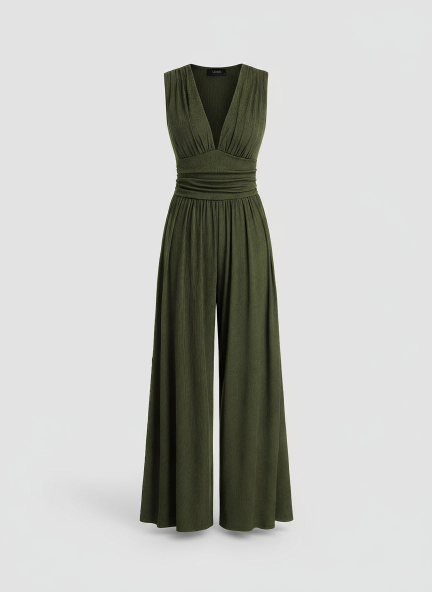 Green jumpsuit on a light gray background