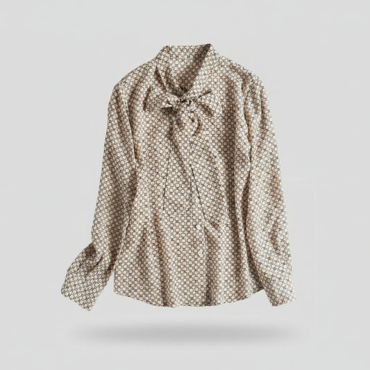 Patterned blouse with a bow tie on a white background