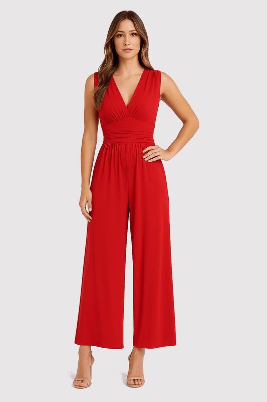 Woman wearing a red jumpsuit on a white background