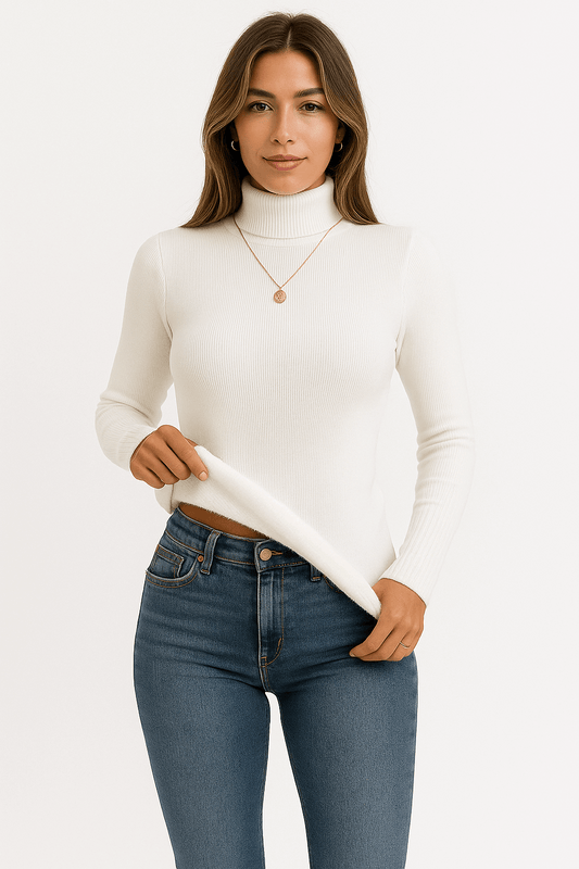 Woman wearing a white turtleneck sweater and blue jeans on a white background
