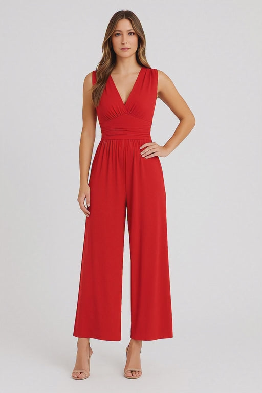 Woman wearing a red jumpsuit on a white background