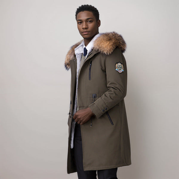 A man model wearing an army green parka coat with fur hoodie