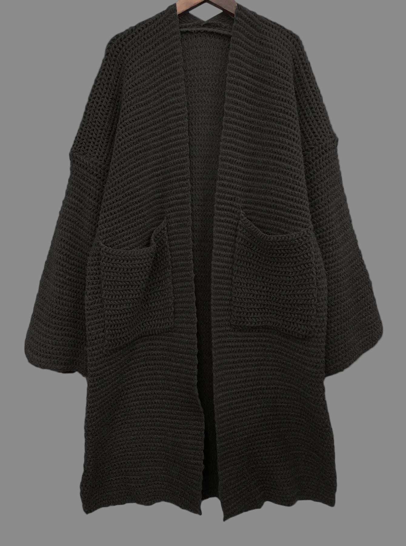 Black knitted cardigan on a white background