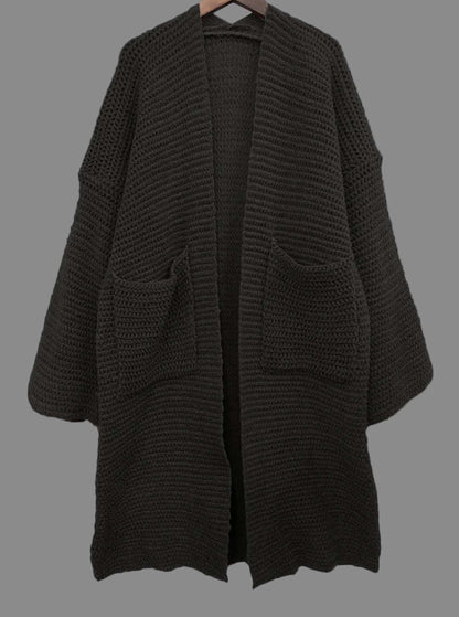 Black knitted cardigan on a white background