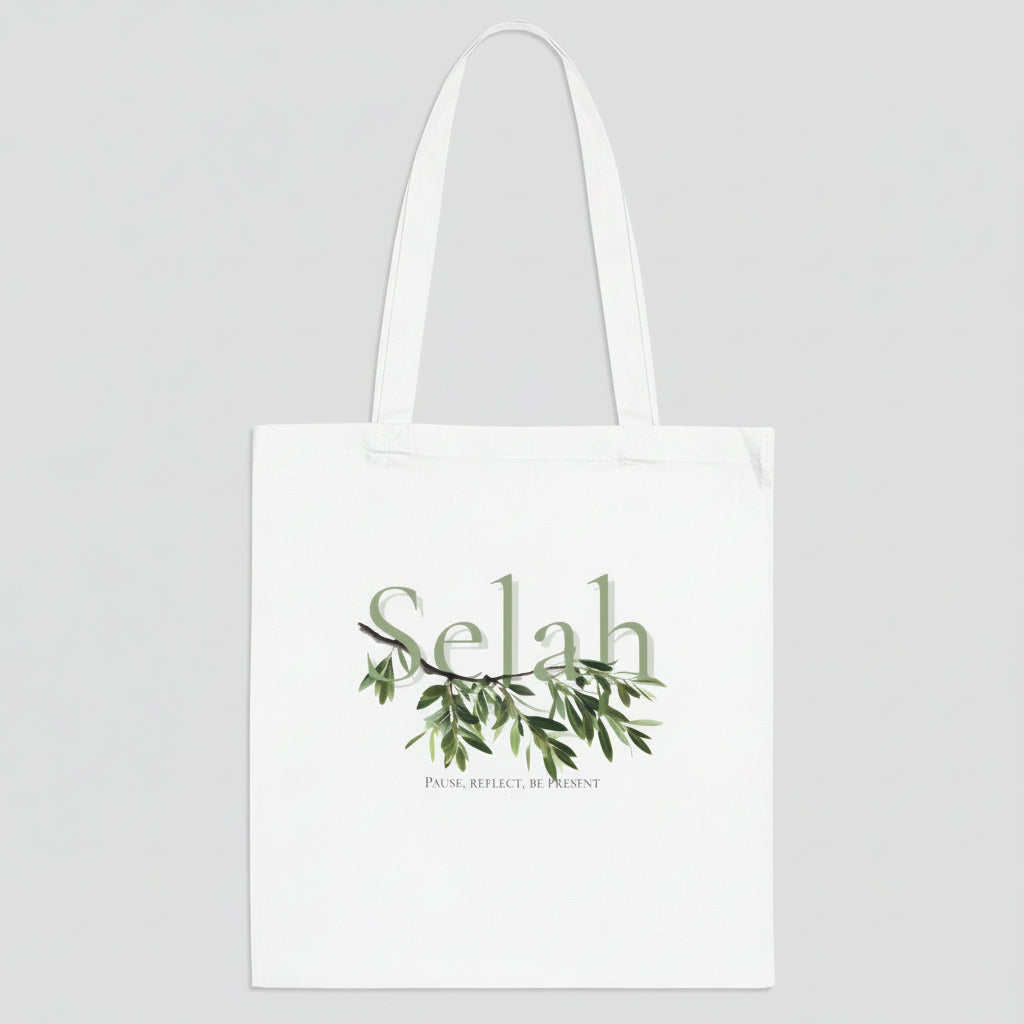 White tote bag with 'Selah' text and green leaf design on a white background