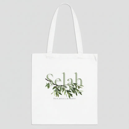 White tote bag with 'Selah' text and green leaf design on a white background