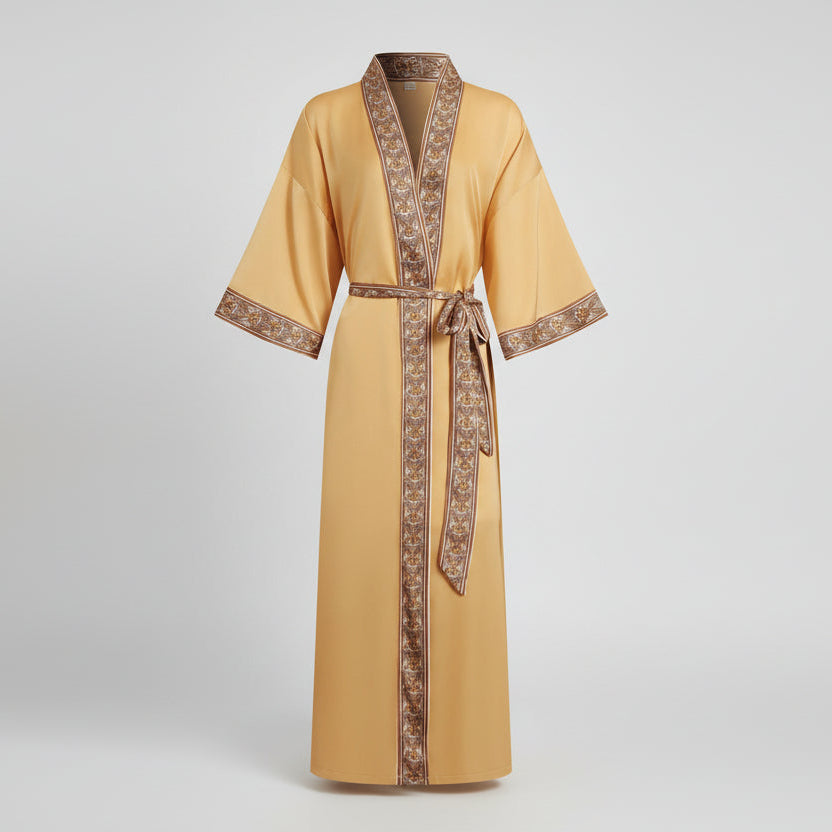 Yellow robe with brown trim on a light gray background