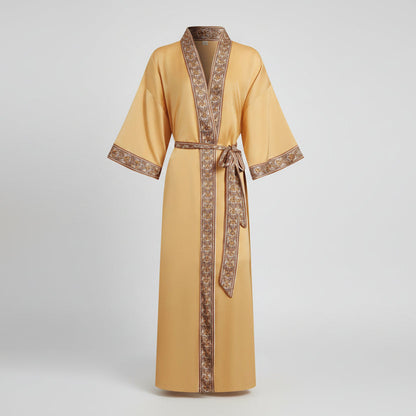 Yellow robe with brown trim on a light gray background