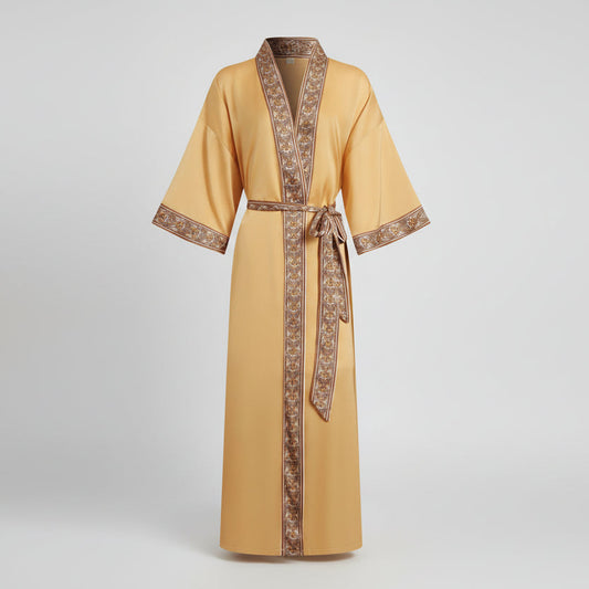 Yellow robe with brown trim on a light gray background