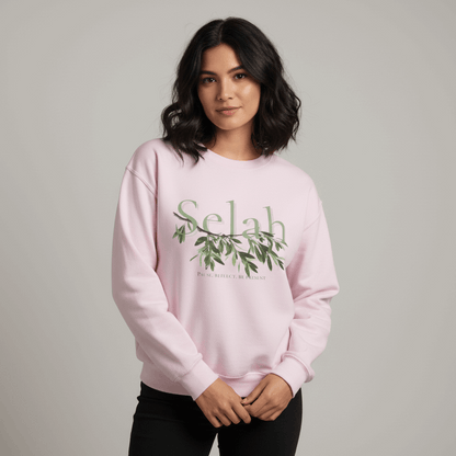 Pink sweatshirt with 'Selah' and leaf design on a white background