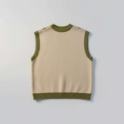 Beige and green striped sweater vest on a fluffy white surface