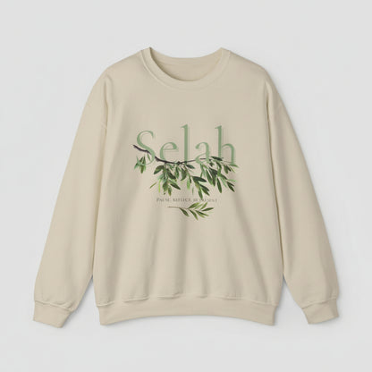 Beige sweatshirt with 'Selah' and olive branch design on a white background