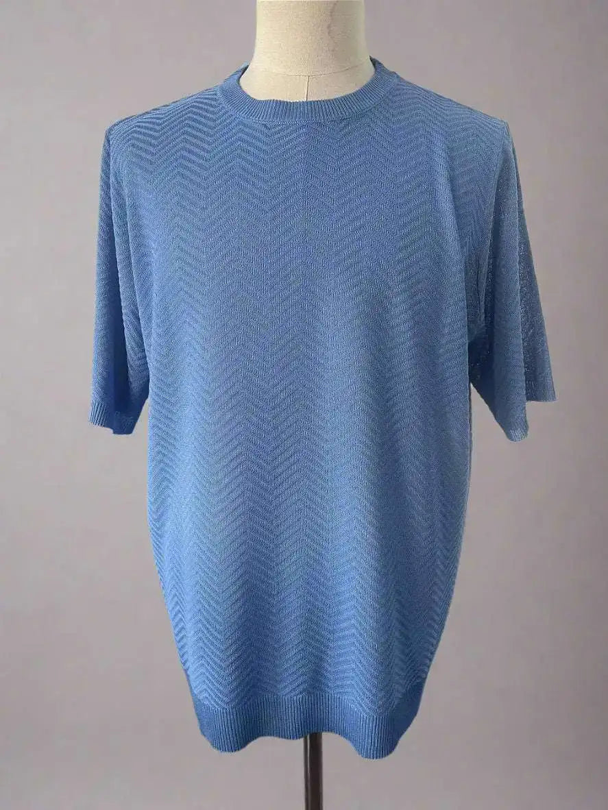 Blue short-sleeve sweater on a mannequin against a plain background