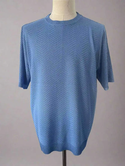 Blue short-sleeve sweater on a mannequin against a plain background