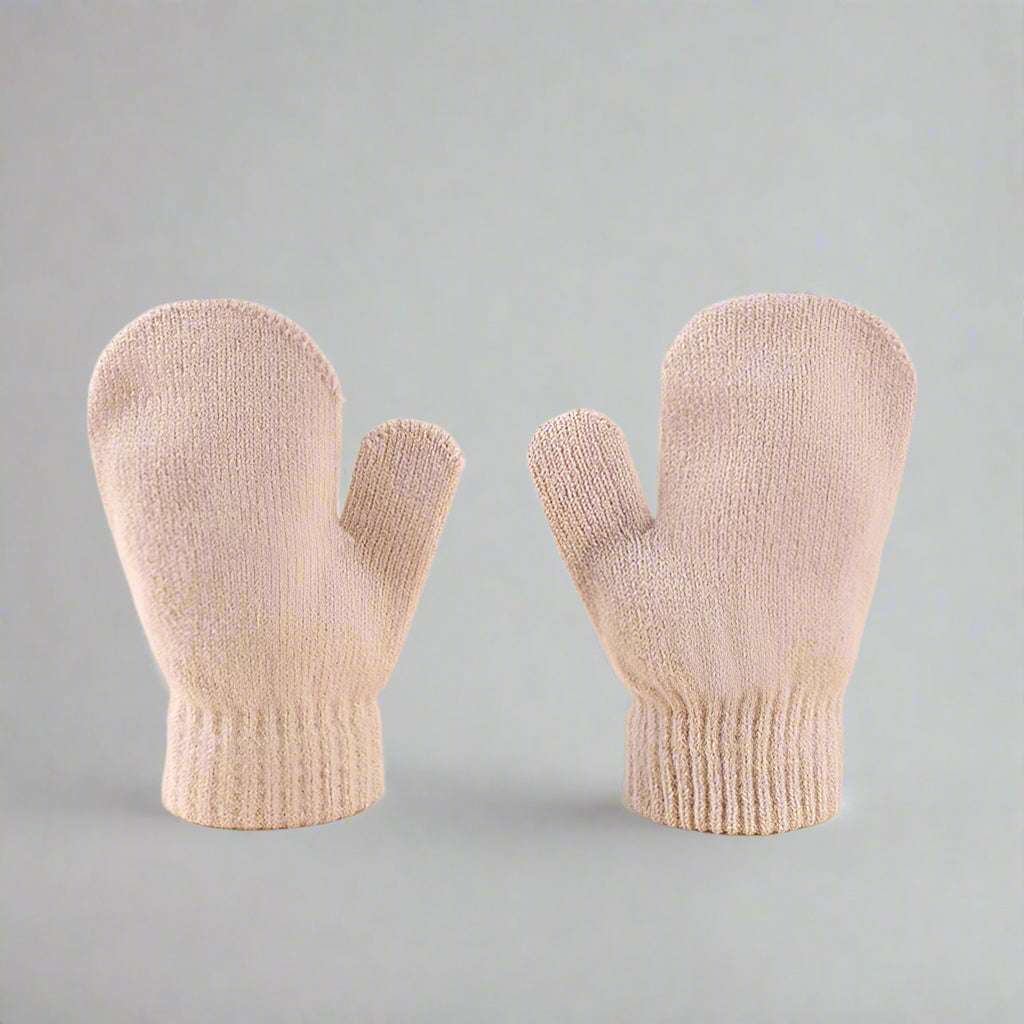 Pair of beige mittens on a gray background