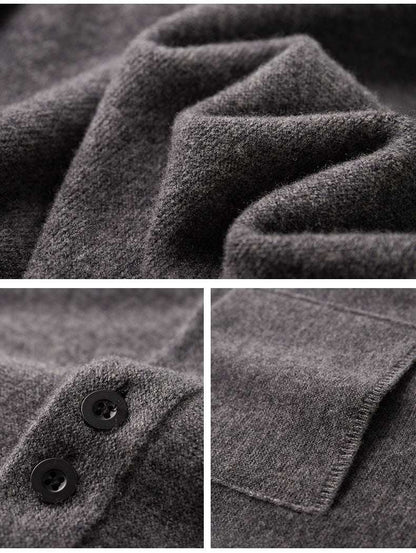 Close-up details of a gray textured fabric with buttons and stitching.