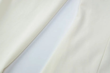 Close-up of light gray fabric with a subtle texture on a white background
