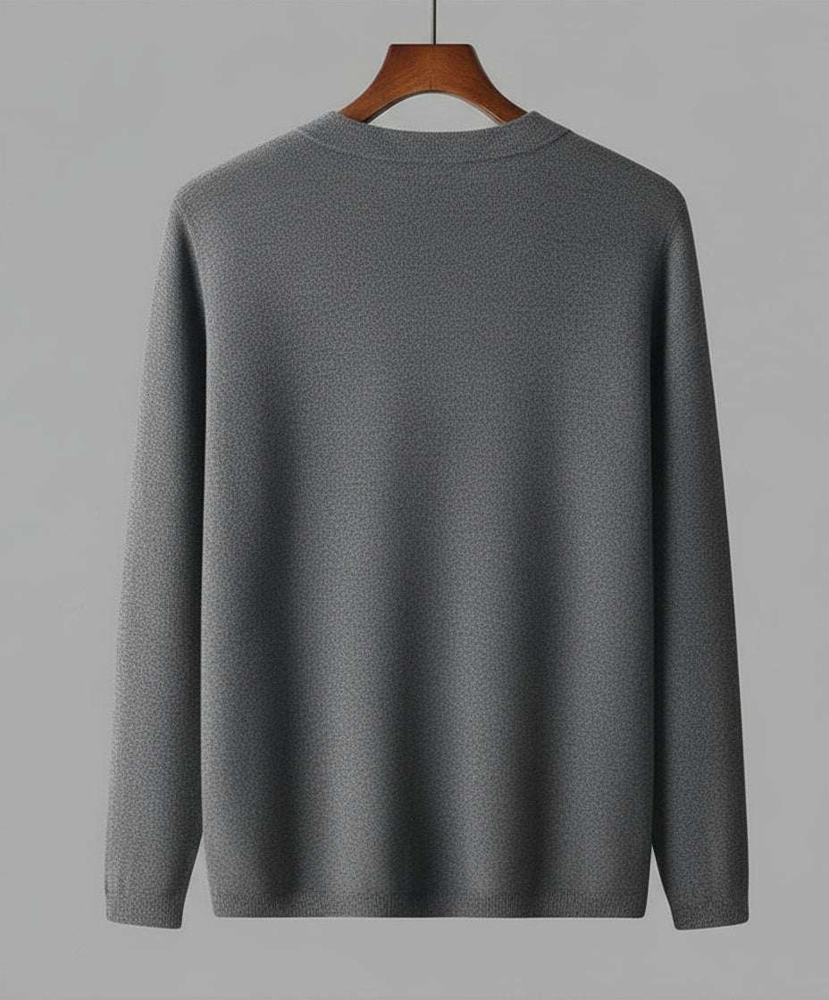 Gray sweater on a hanger against a gray background