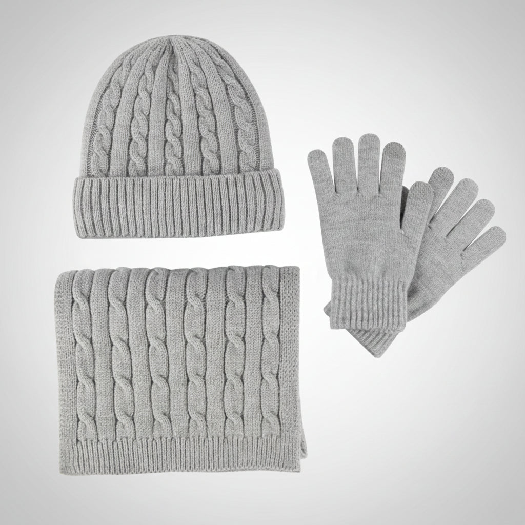 Gray knit hat, scarf, and gloves set on a light gray background