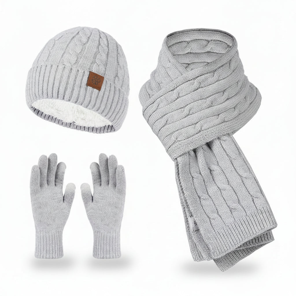 Gray knit hat, scarf, and gloves set on a white background