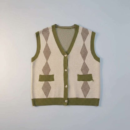 Green and beige argyle patterned sweater vest on a white fur background