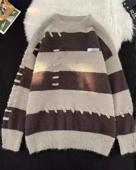Striped sweater with brown and beige colors on a dark background