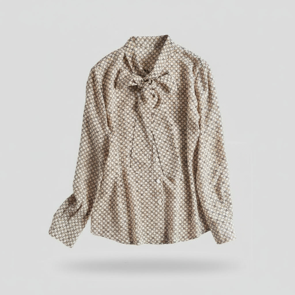 Patterned blouse with a bow tie on a white background