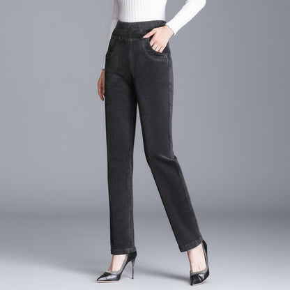 Person wearing dark gray pants on a gray background
