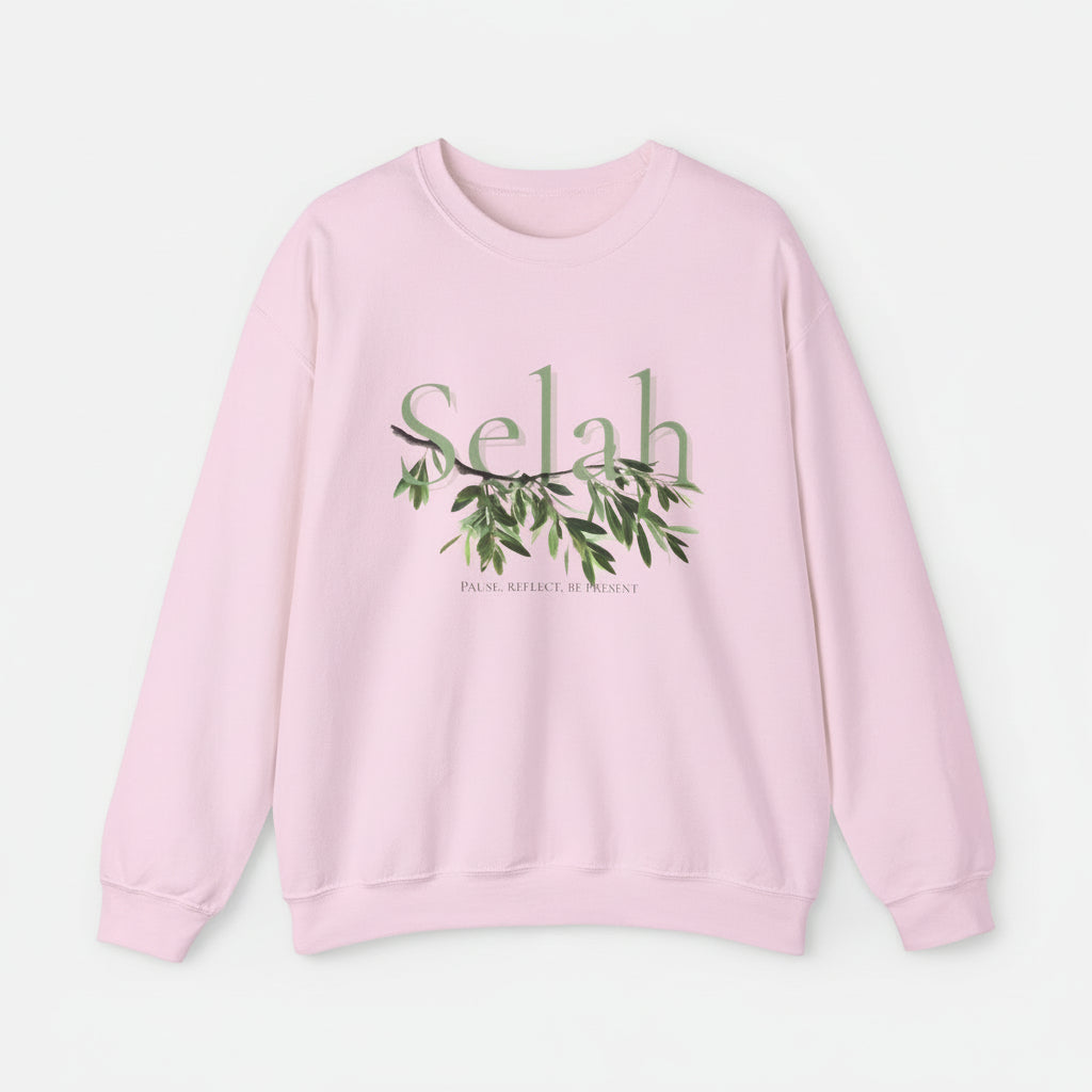 Pink sweatshirt with 'Selah' and leaf design on a white background