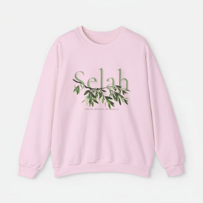 Pink sweatshirt with 'Selah' and leaf design on a white background