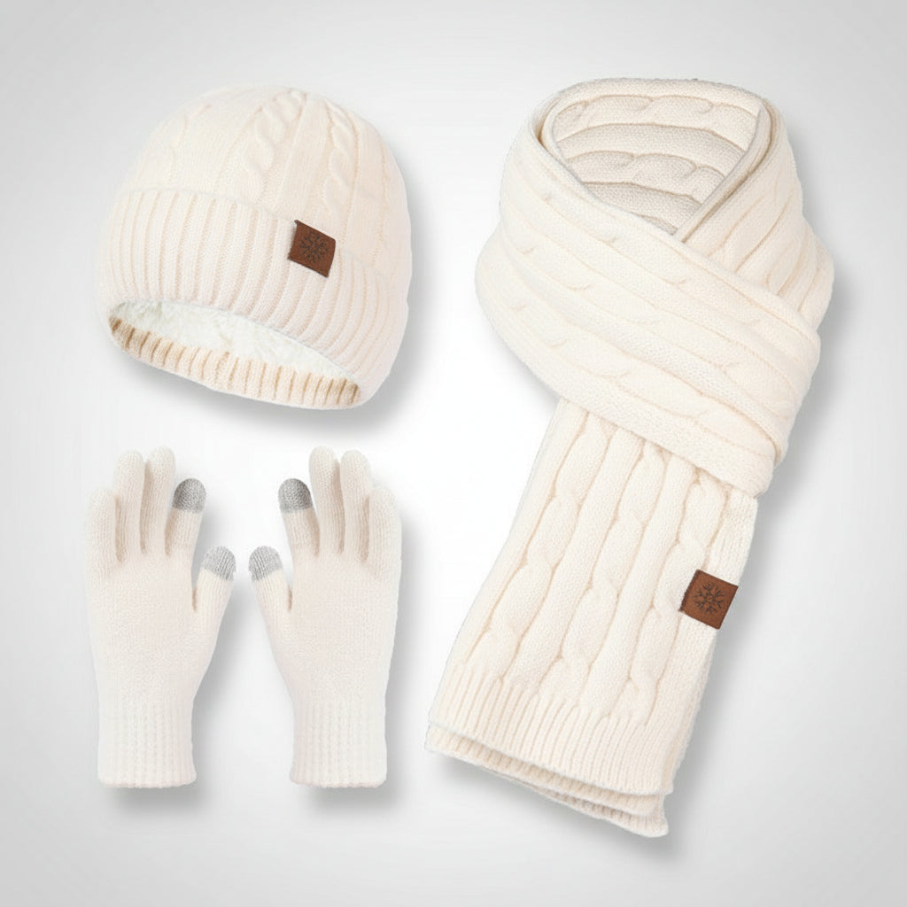 Set of cream-colored knit hat, scarf, and gloves on a light gray background