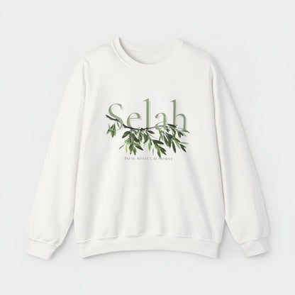 White sweatshirt with 'Selah' and olive branch design on a white background
