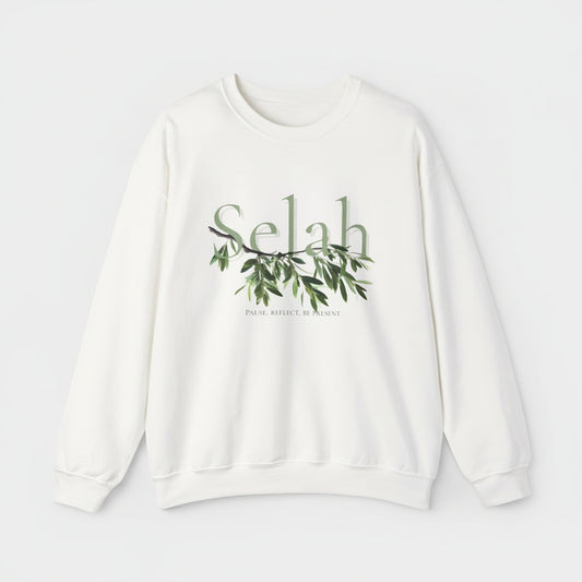 White sweatshirt with 'Selah' and olive branch design on a white background