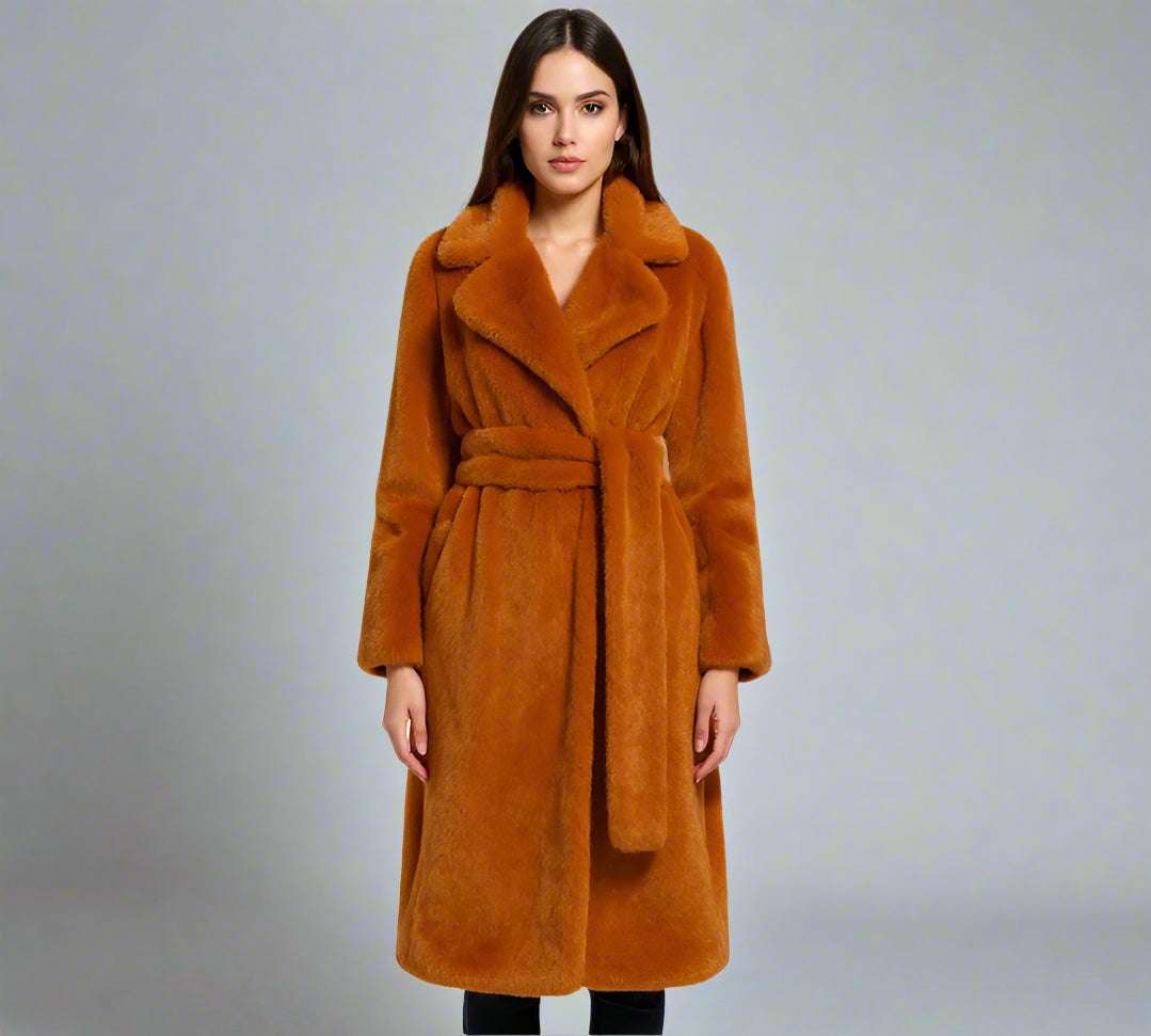 Woman wearing a orange coat on a white background