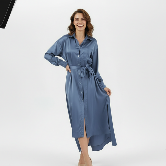 Woman wearing a blue dress with a white background