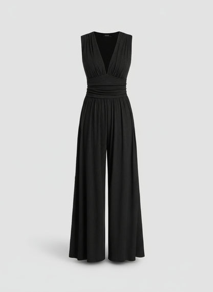 Black jumpsuit on a light agray background