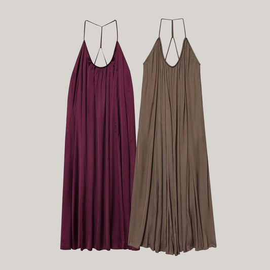 Two long dresses, one purple and one brown, on a light gray background.