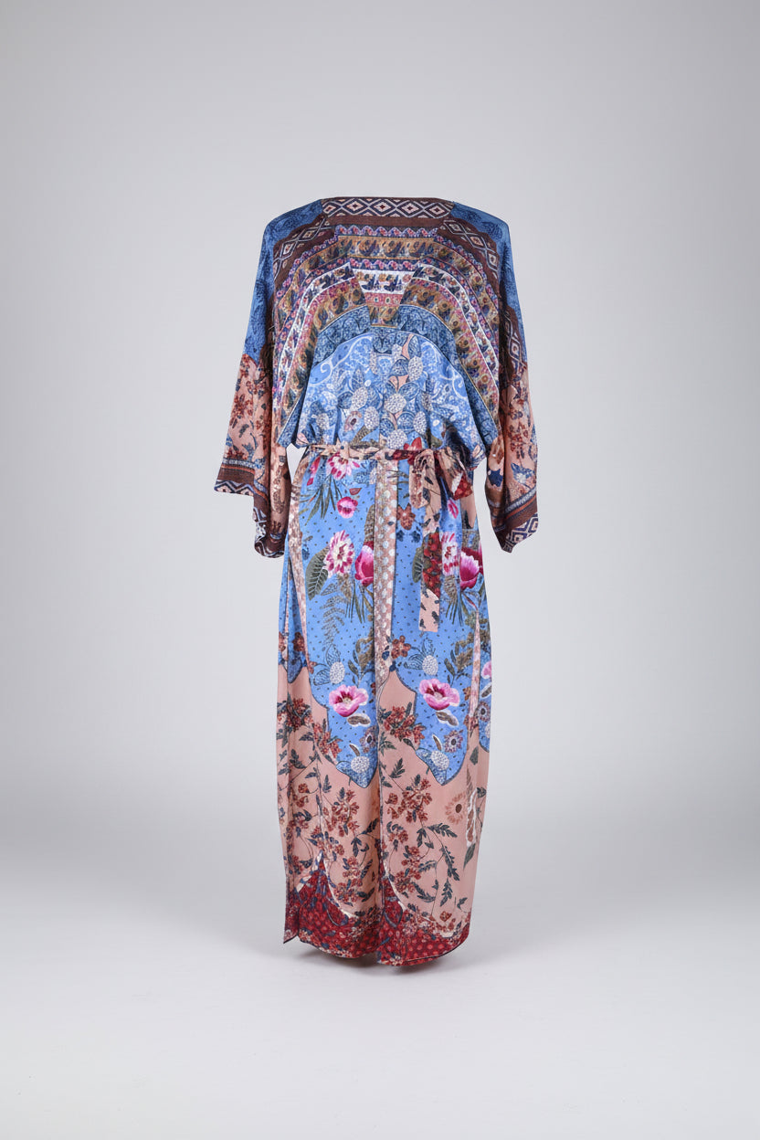 Colorful floral and geometric patterned dress on a white background