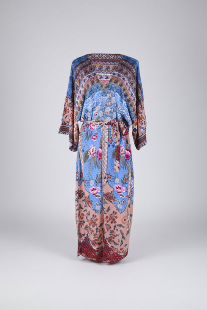 Colorful floral and geometric patterned dress on a white background