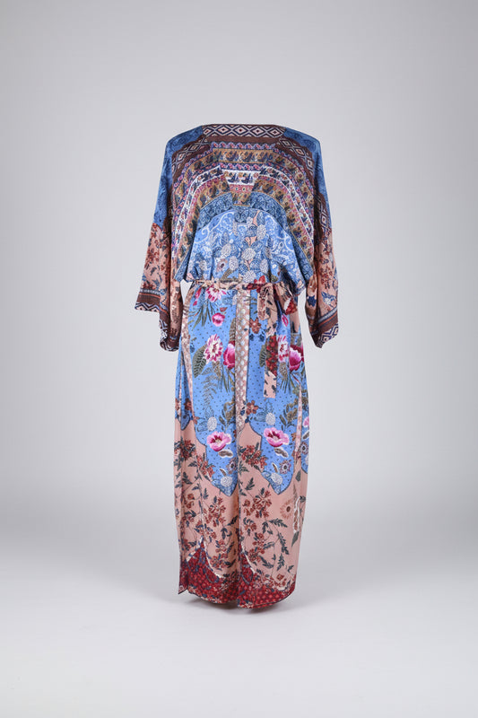 Colorful floral and geometric patterned dress on a white background