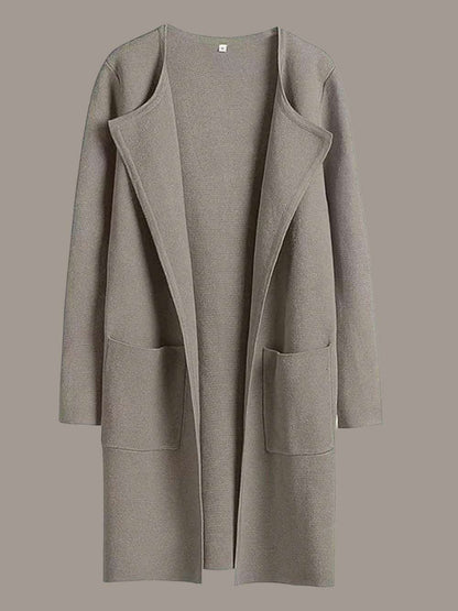 Taupe coat with a plain background