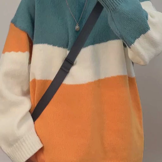 Unisex color block sweater in teal green cream and orange